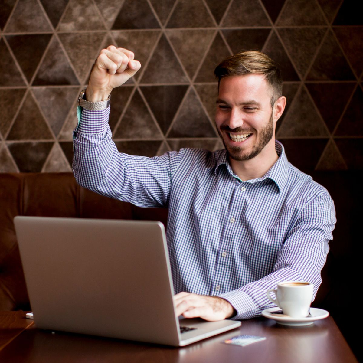 Man cheering at success